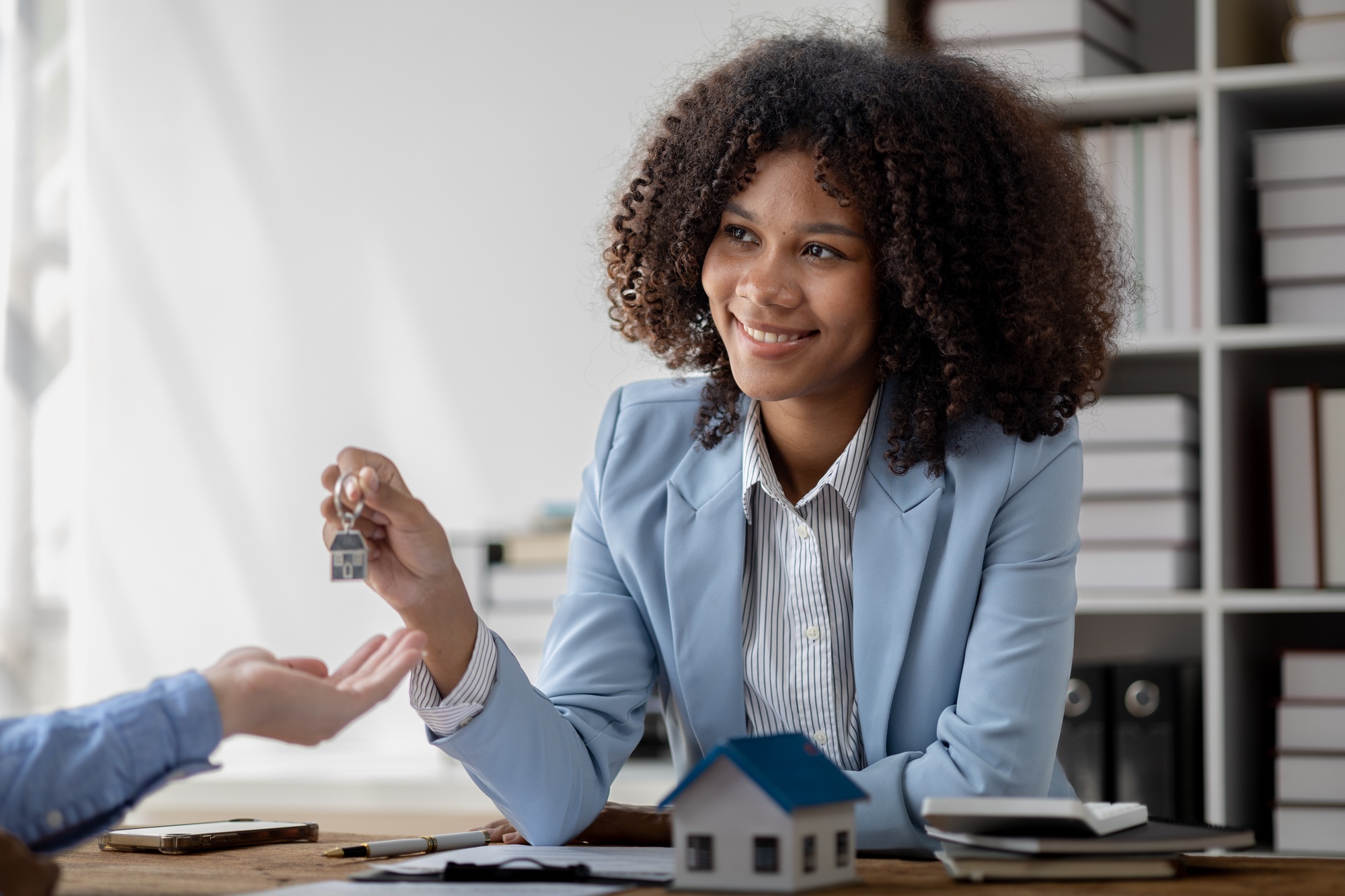 An American woman is a land and real estate broker for houses and condos, she is a real estate broke