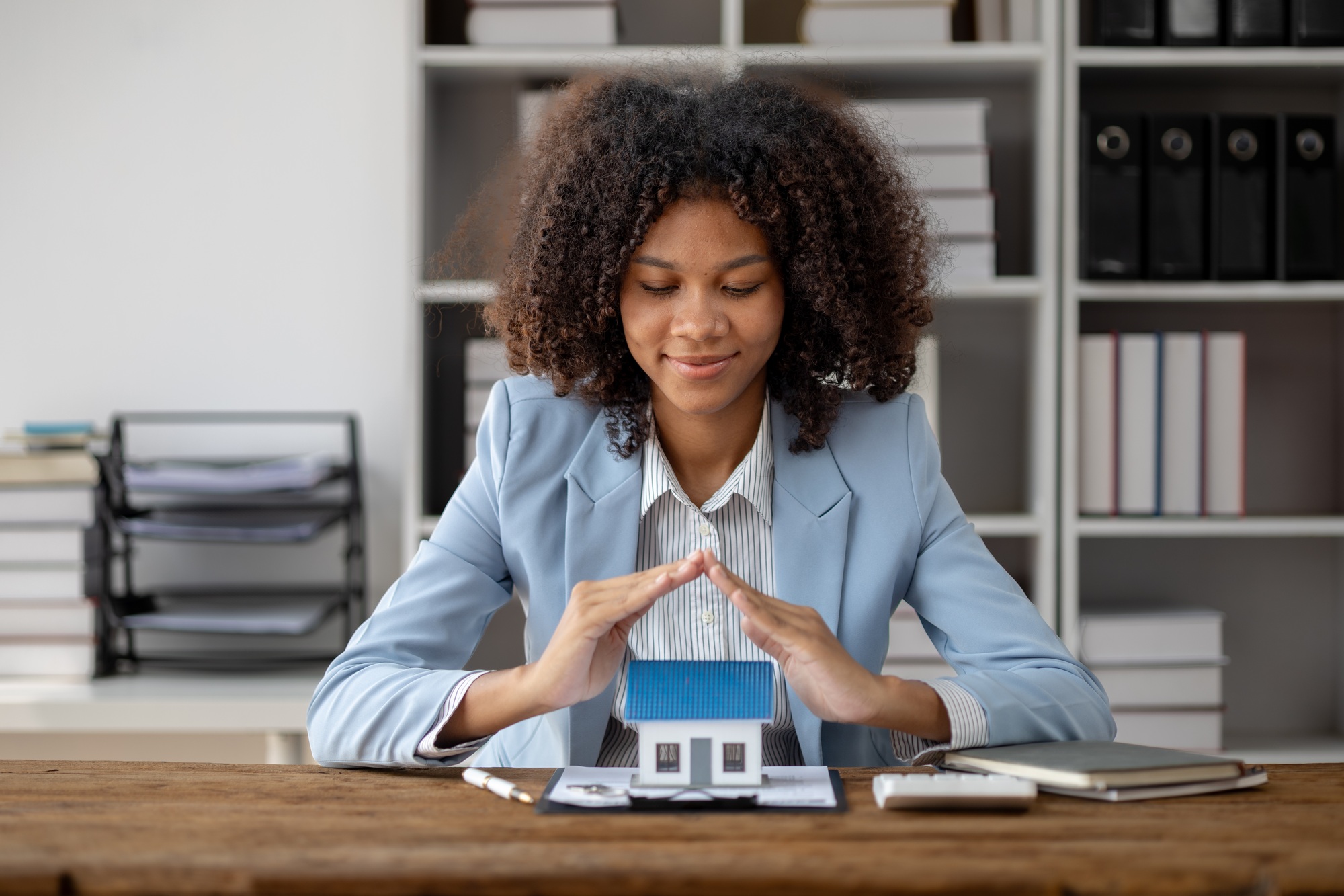 An American woman is a land and real estate broker for houses and condos, she is a real estate broke