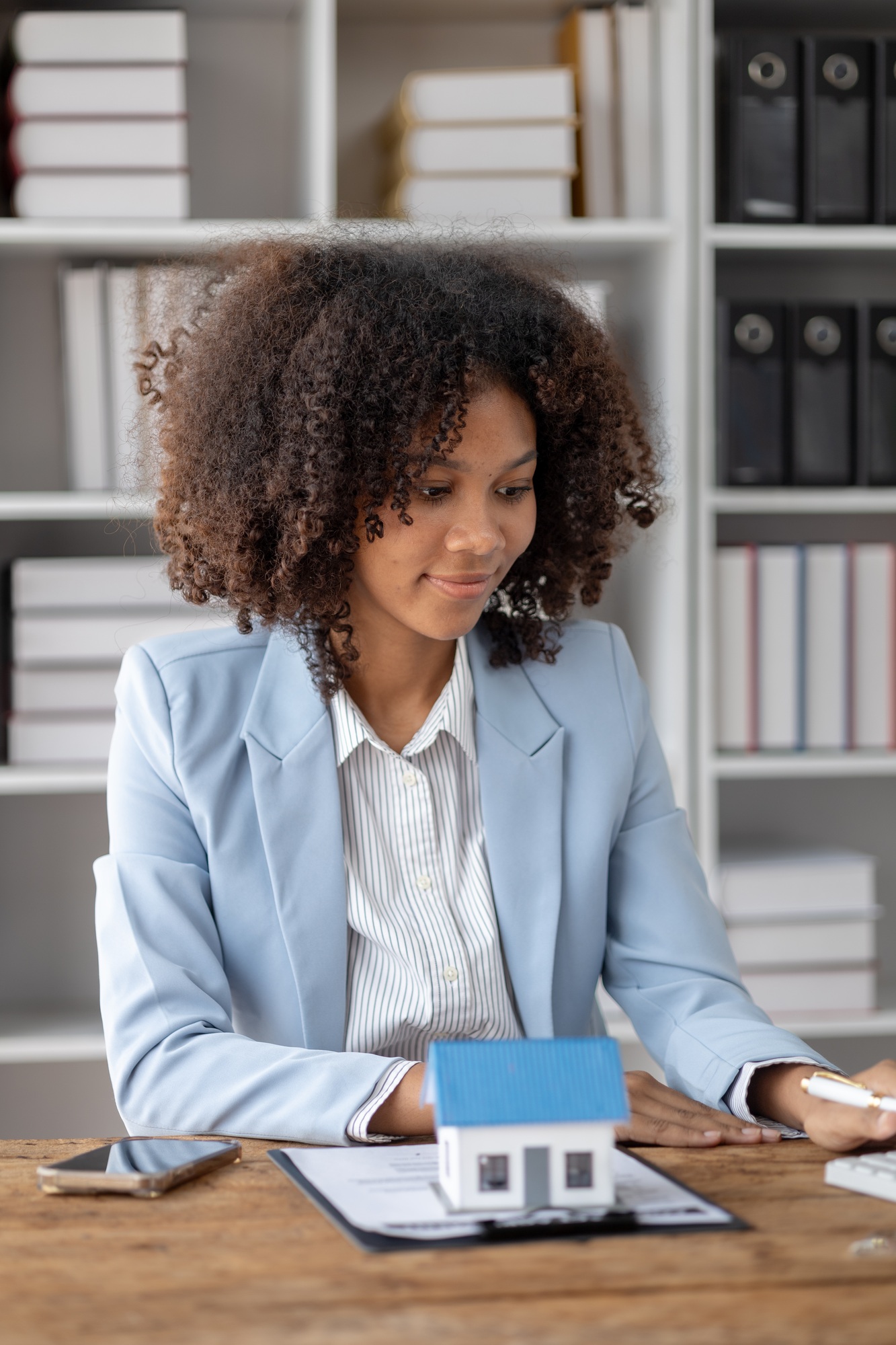 An American woman is a land and real estate broker for houses and condos, she is a real estate broke